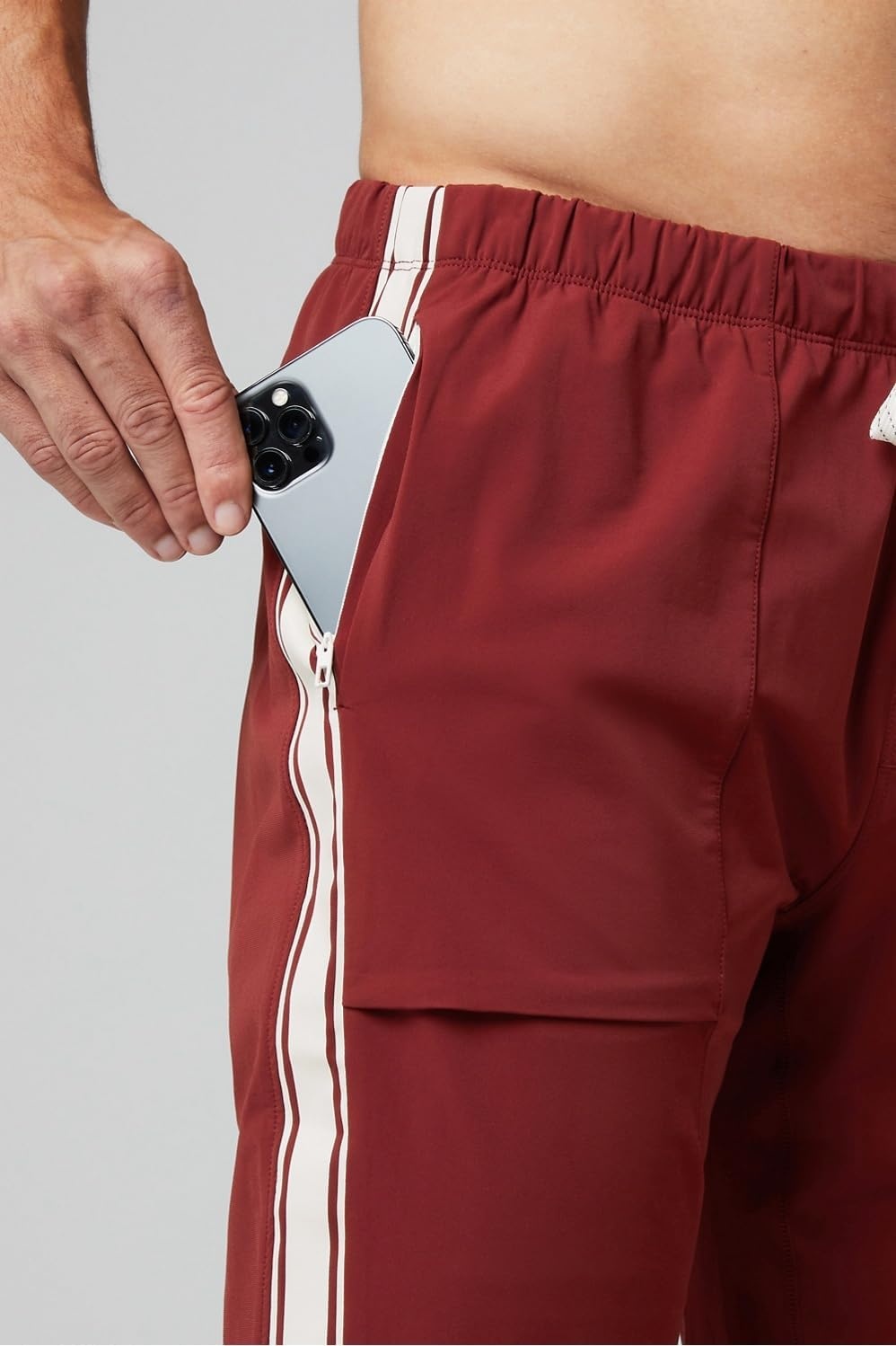image:imageFabletics Mens The One Jogger QuickDry Hidden Pockets Zip Pockets UPF Protection AntiStink LightweightAdrenaline RedBone Stripe