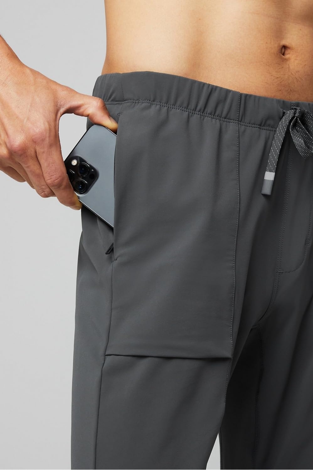 image:imageFabletics Mens The One Jogger QuickDry Hidden Pockets Zip Pockets UPF Protection AntiStink LightweightOnyx