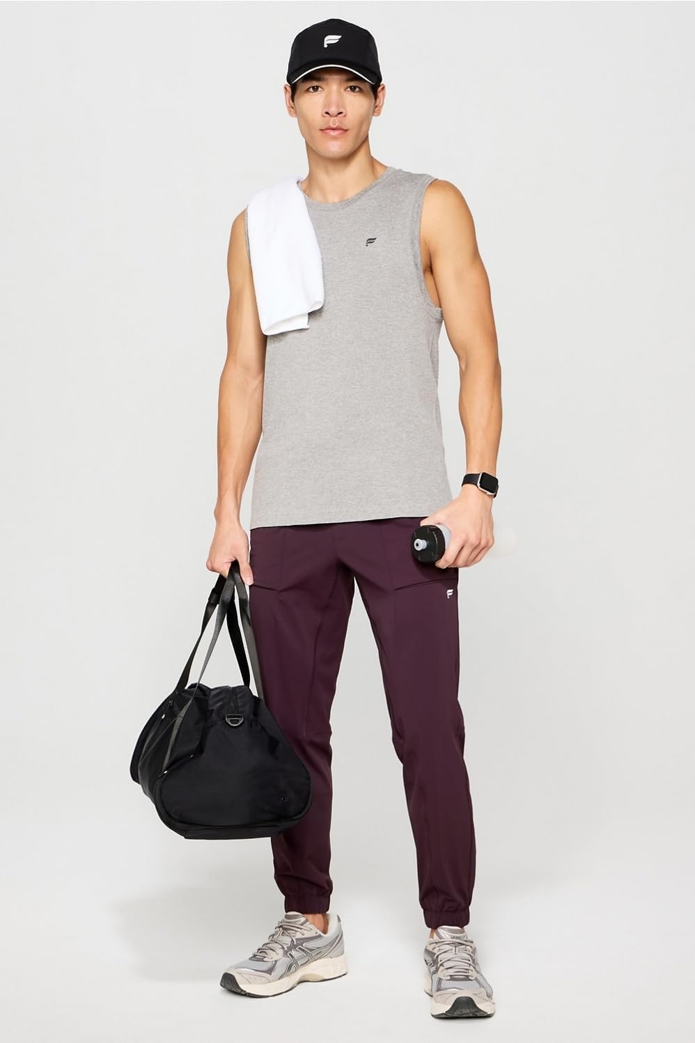 image:imageFabletics Mens The One Jogger QuickDry Hidden Pockets Zip Pockets UPF Protection AntiStink LightweightOxblood
