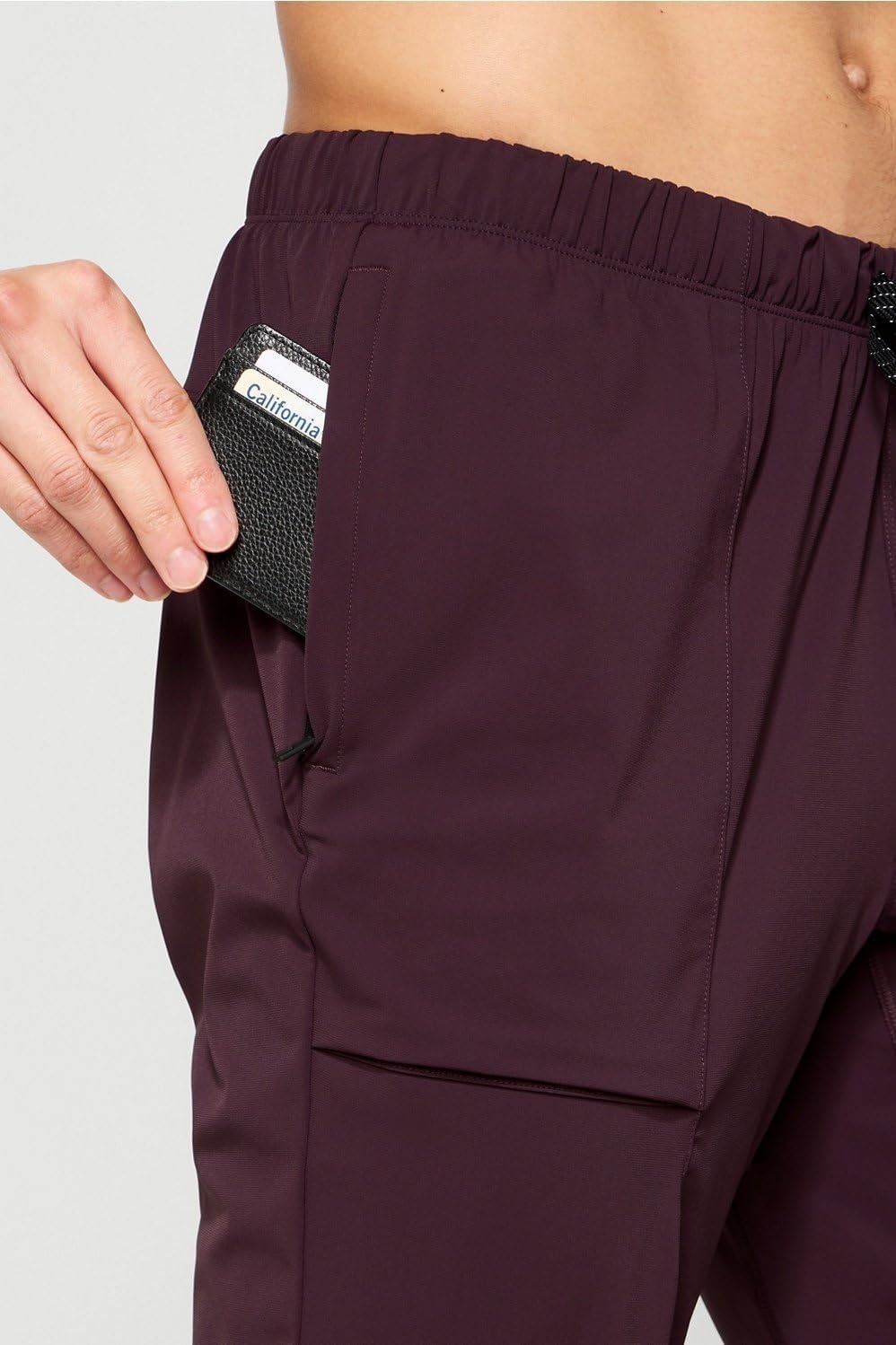 image:imageFabletics Mens The One Jogger QuickDry Hidden Pockets Zip Pockets UPF Protection AntiStink LightweightOxblood