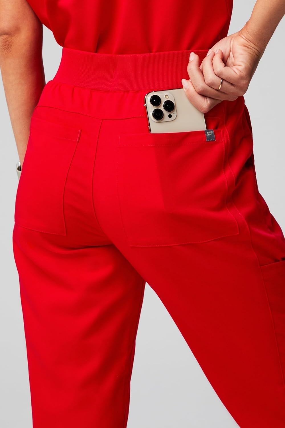 image:imageFabletics Womens Active Scrub Jogger MotionTech PocketPacked Lightweight WrinkleResist SemiSlim FitGoji Red