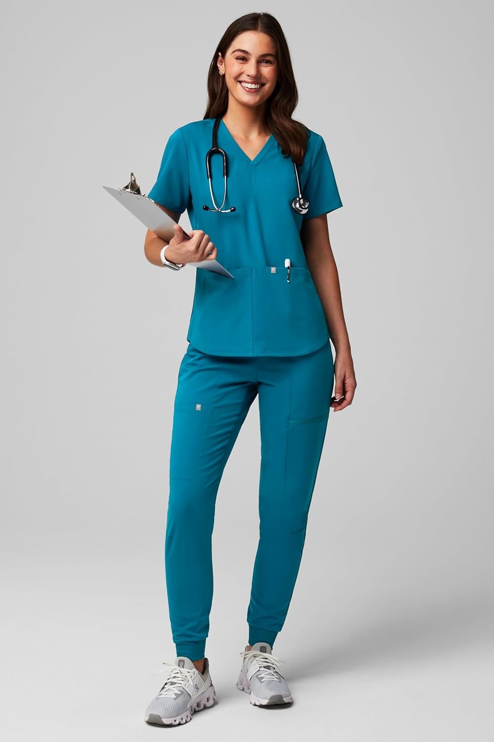 image:imageFabletics Womens Method 2Pocket Scrub Top MotionTech 4Way Stretch WrinkleResist AntiShrinkCaribbean Blue