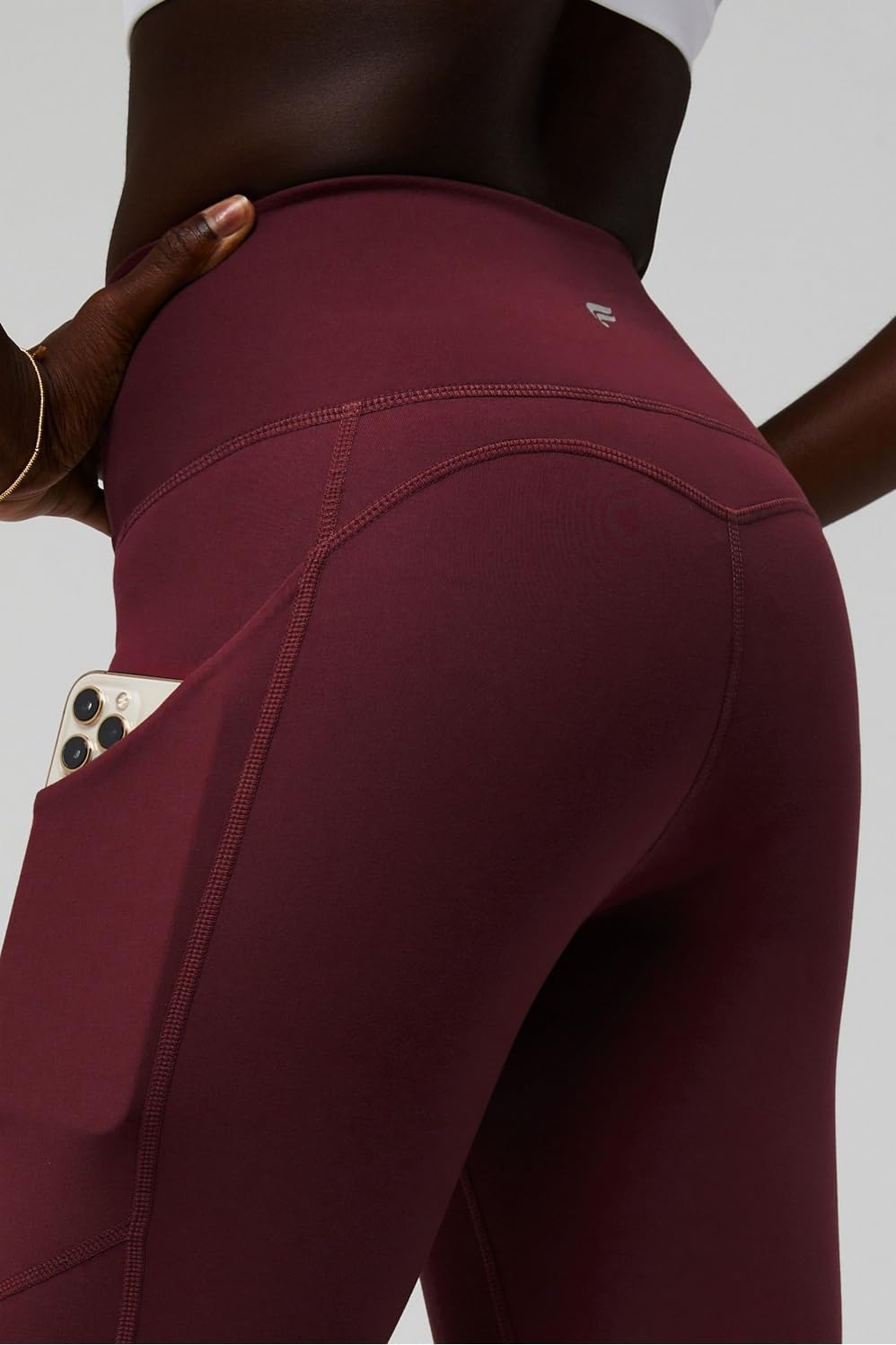 image:imageFabletics Womens Oasis Pureluxe HighWaisted Kick Flare Light Compression Buttery SoftMerlot