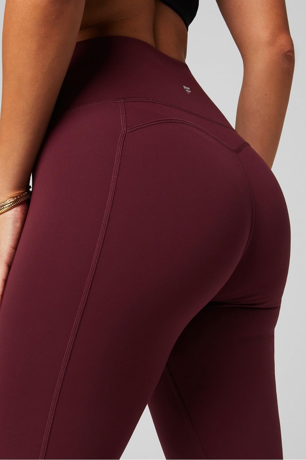 image:imageFabletics Womens Oasis Pureluxe HighWaisted Kick Flare Light Compression Buttery SoftMerlot