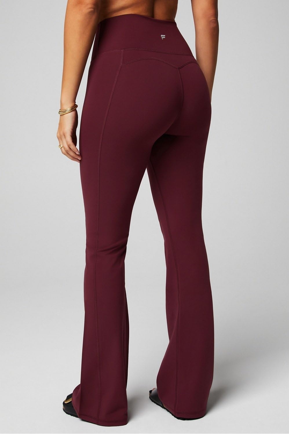image:imageFabletics Womens Oasis Pureluxe HighWaisted Kick Flare Light Compression Buttery SoftMerlot