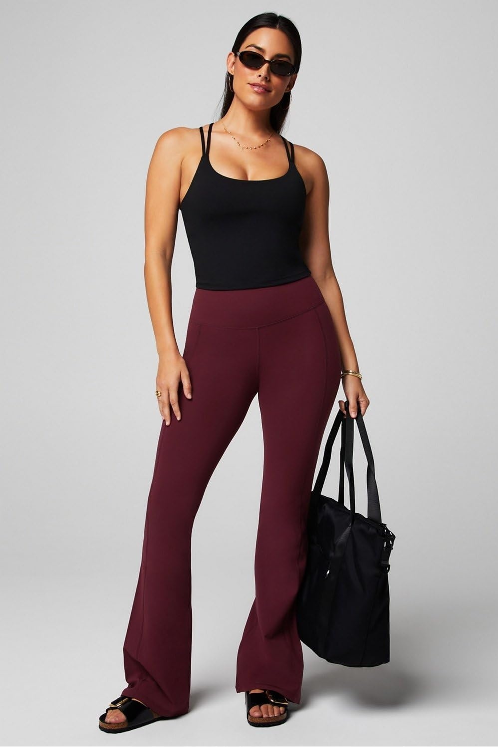 image:imageFabletics Womens Oasis Pureluxe HighWaisted Kick Flare Light Compression Buttery SoftMerlot