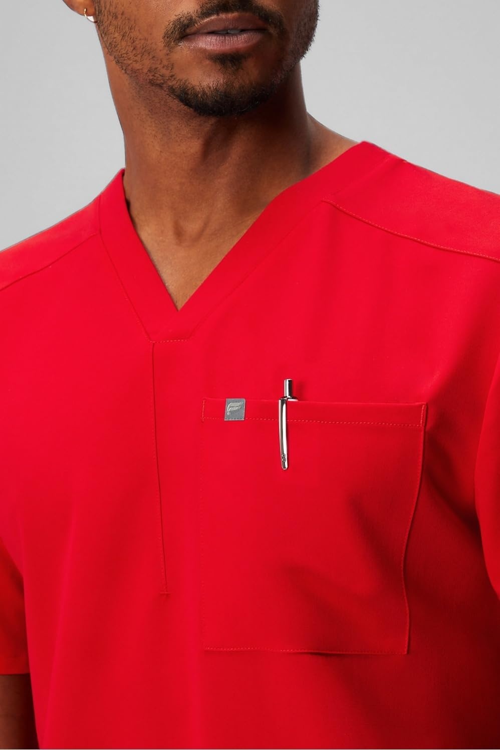 image:imageFabletics Mens Helix 1Pocket Scrub Top MotionTech WrinkleResist Chest Pocket AntiShrink SemiSlim FitGoji Red