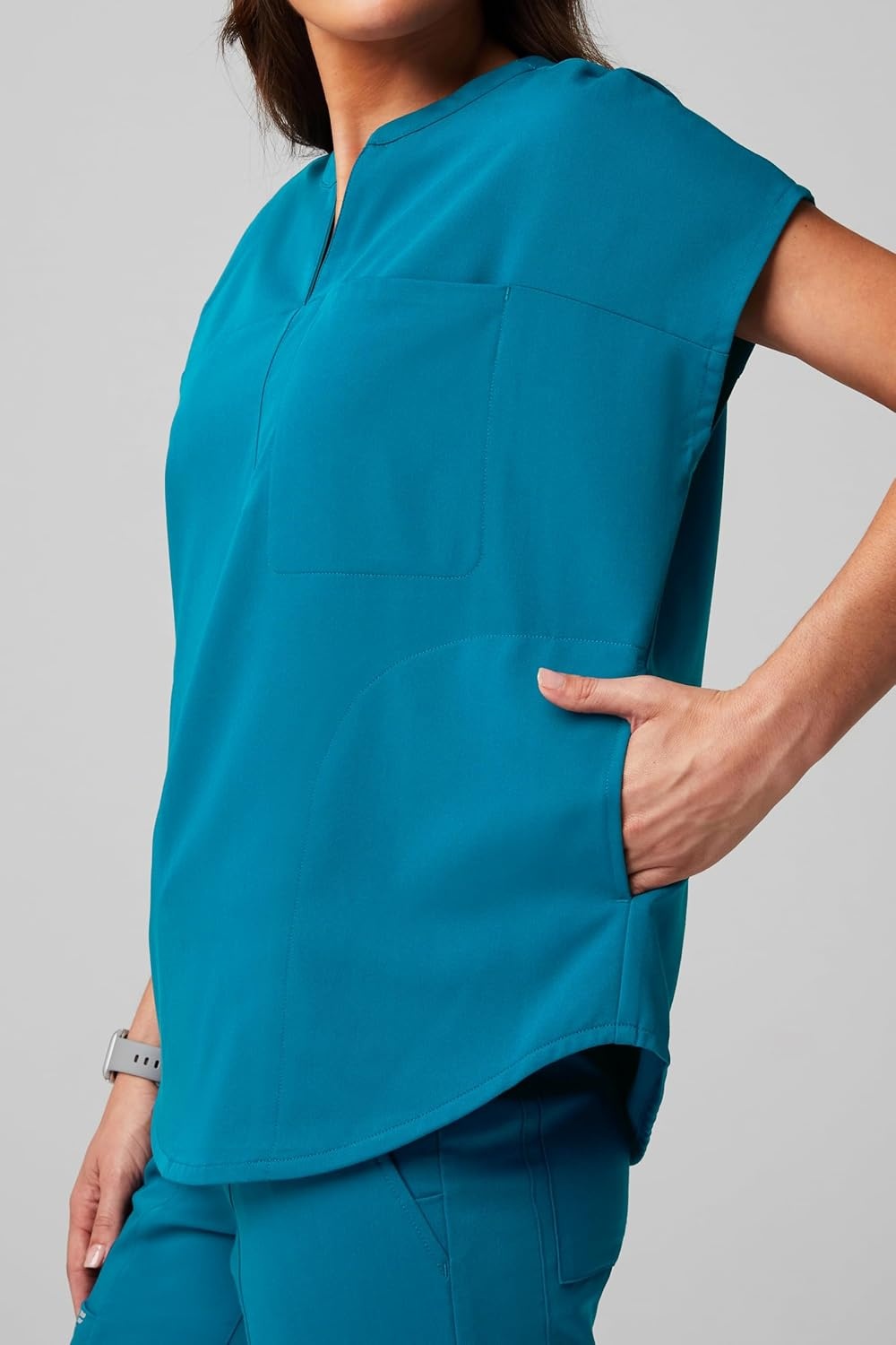 image:imageFabletics Womens Evolve 3Pocket Scrub Top with an Oversized Fit MotionTech 4Way Stretch WrinkleResist AntiShrinkCaribbean Blue
