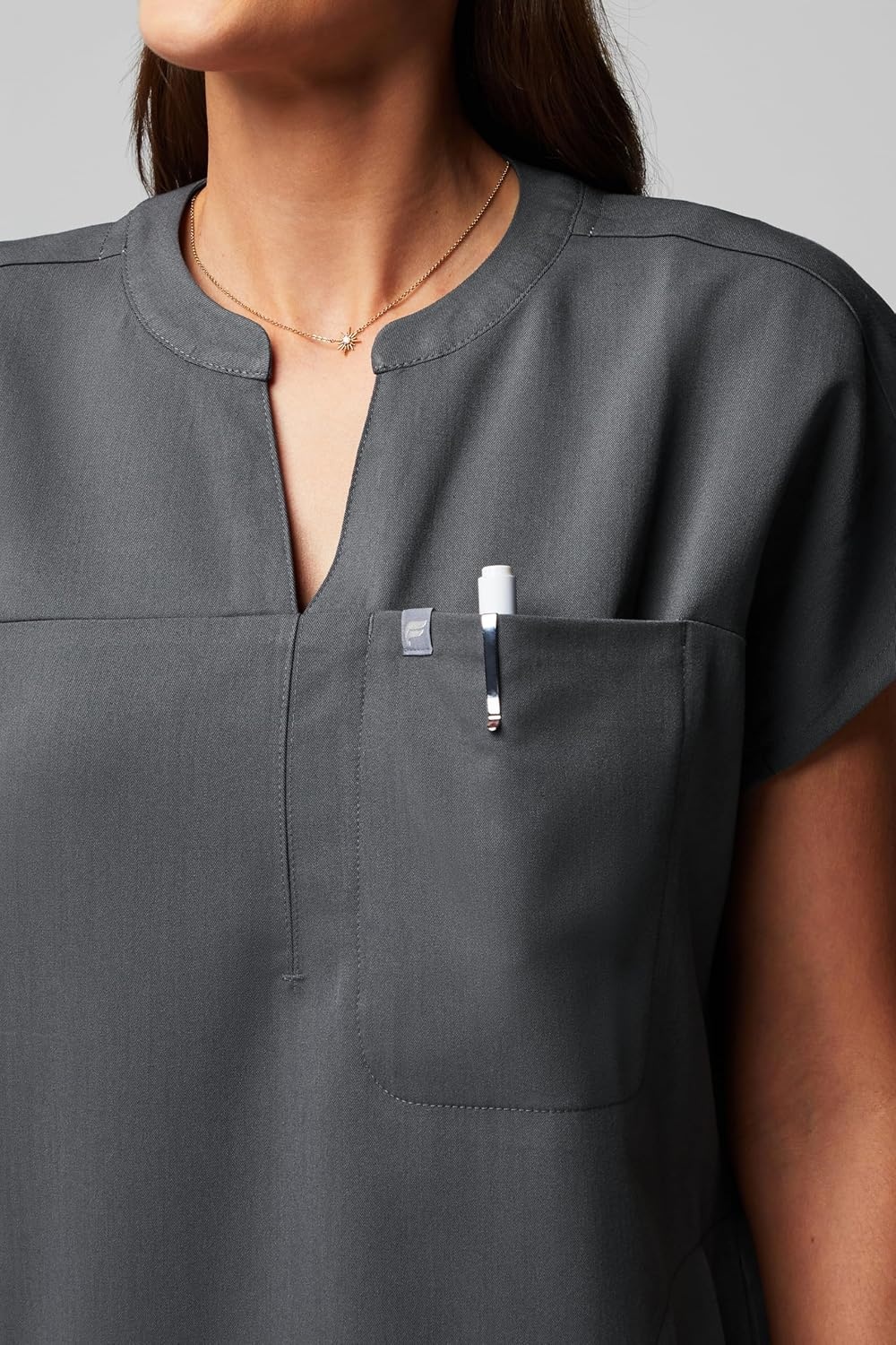 image:imageFabletics Womens Evolve 3Pocket Scrub Top with an Oversized Fit MotionTech 4Way Stretch WrinkleResist AntiShrinkOnyx