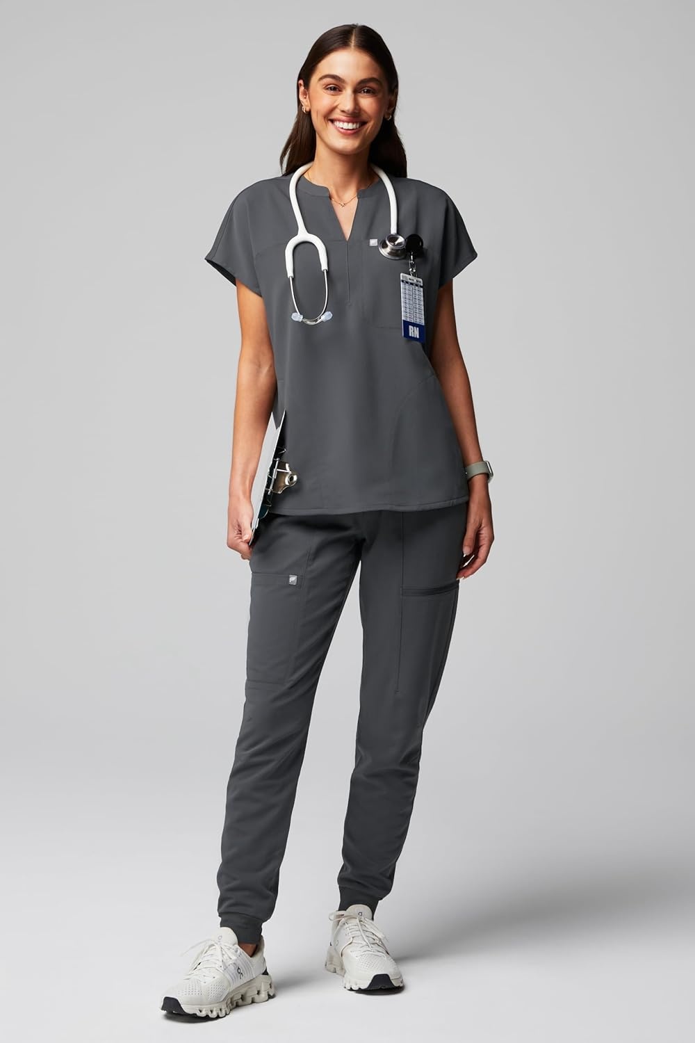 image:imageFabletics Womens Evolve 3Pocket Scrub Top with an Oversized Fit MotionTech 4Way Stretch WrinkleResist AntiShrinkOnyx