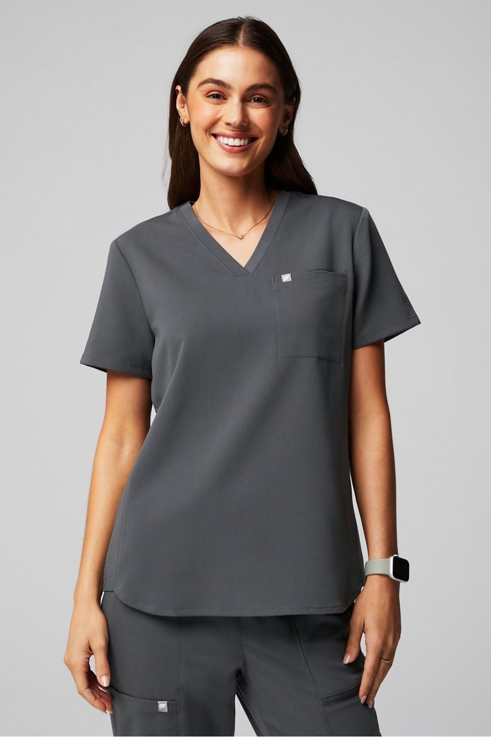 image:imageFabletics Womens Evolve 3Pocket Scrub Top with an Oversized Fit MotionTech 4Way Stretch WrinkleResist AntiShrinkOnyx