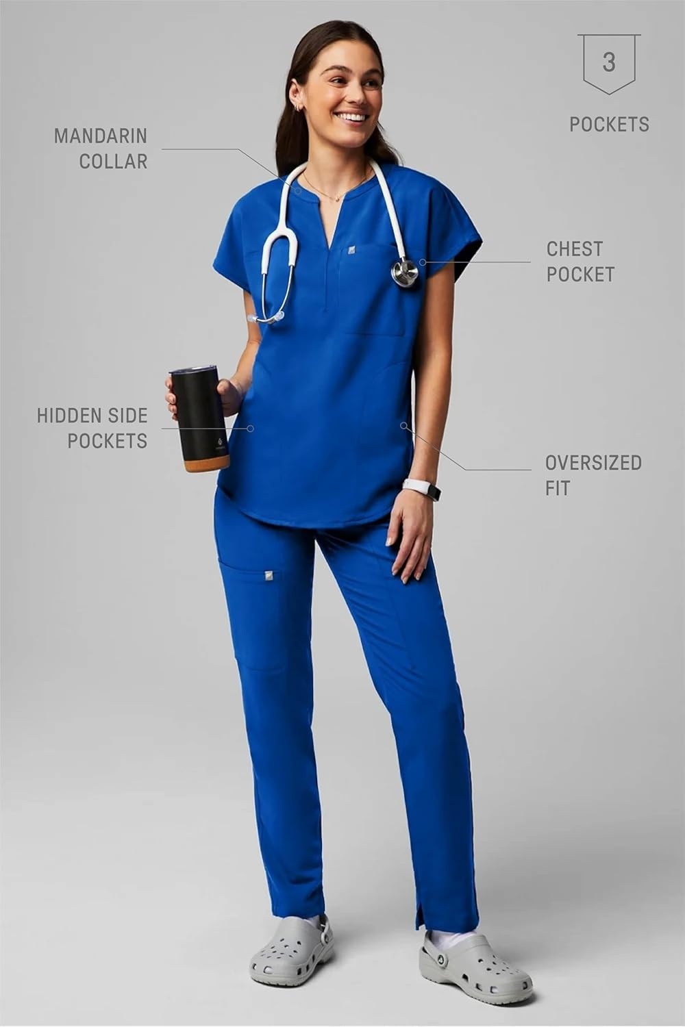 image:imageFabletics Womens Evolve 3Pocket Scrub Top with an Oversized Fit MotionTech 4Way Stretch WrinkleResist AntiShrinkRoyal Blue