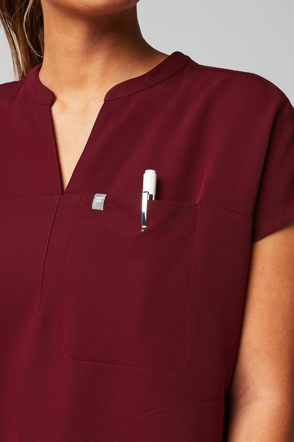 image:imageFabletics Womens Evolve 3Pocket Scrub Top with an Oversized Fit MotionTech 4Way Stretch WrinkleResist AntiShrinkWine