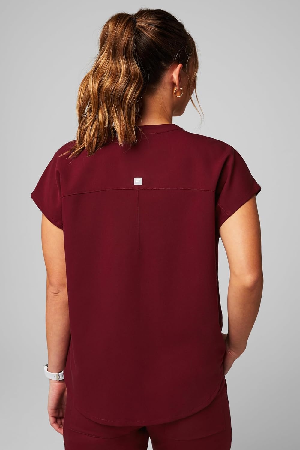 image:imageFabletics Womens Evolve 3Pocket Scrub Top with an Oversized Fit MotionTech 4Way Stretch WrinkleResist AntiShrinkWine