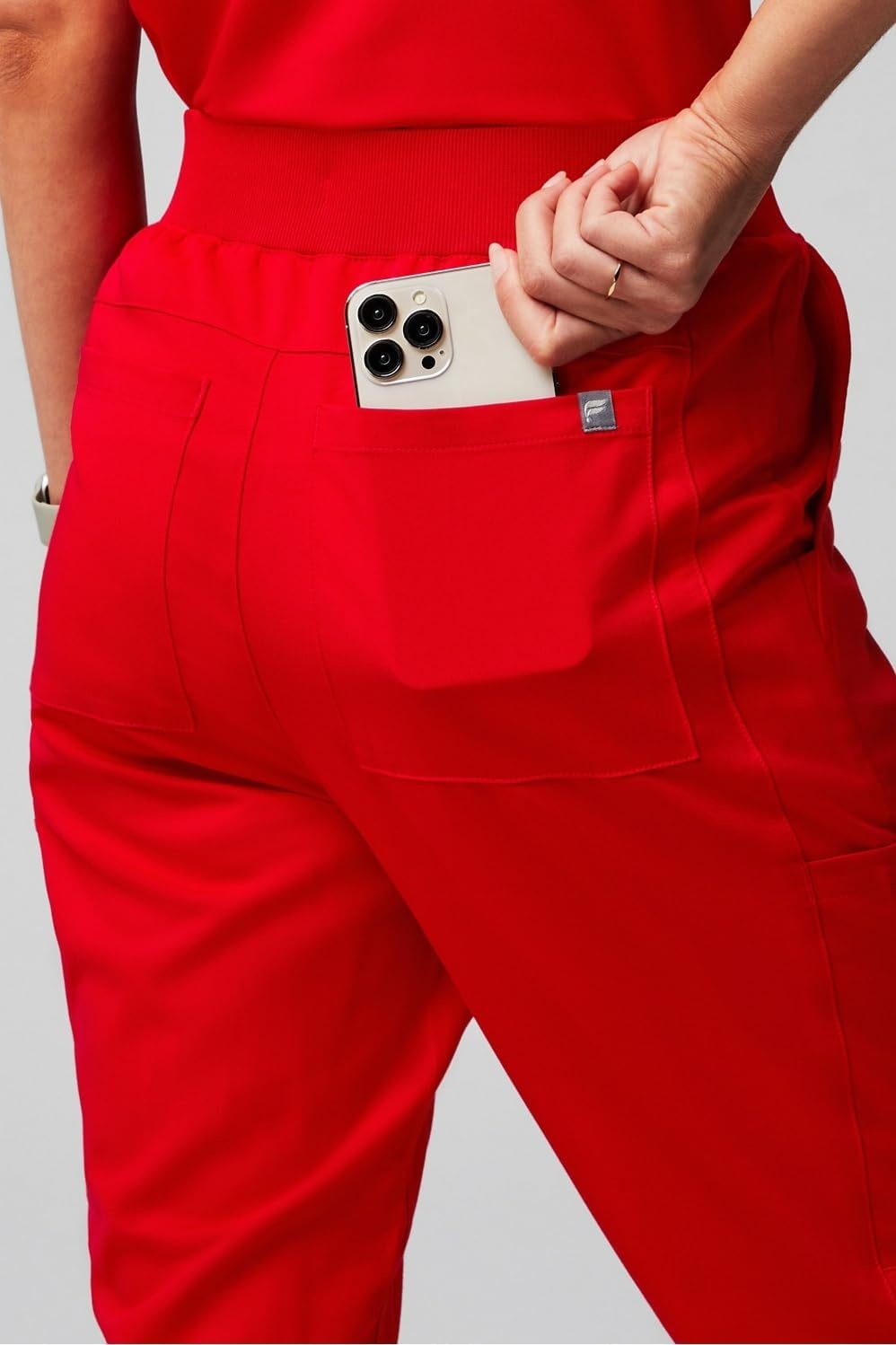 image:imageFabletics Womens High Rise Active Scrub Jogger MotionTech 4Way Stretch PocketPacked Lightweight SemiSlim FitGoji Red