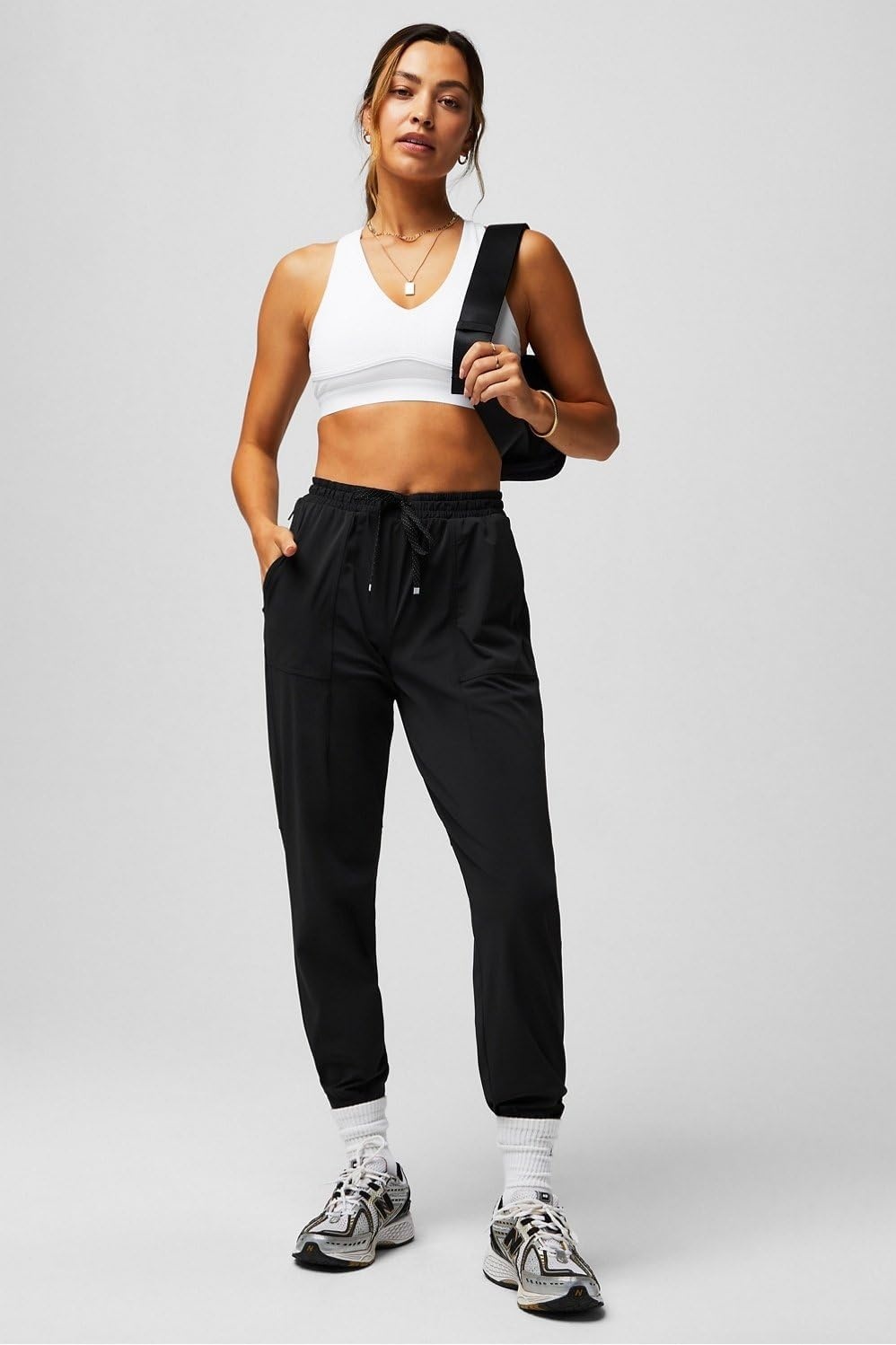 image:imageFabletics Womens The One Jogger QuickDry Hidden Pockets Zip Pockets UPF Protection AntiStink LightweightBlack