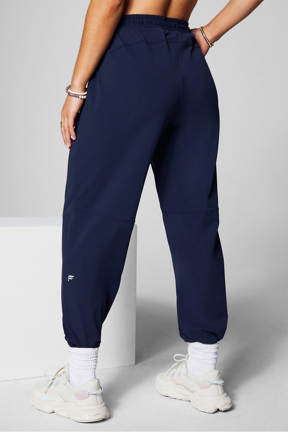 image:imageFabletics Womens The One Jogger QuickDry Hidden Pockets Zip Pockets UPF Protection AntiStink LightweightDeep Navy