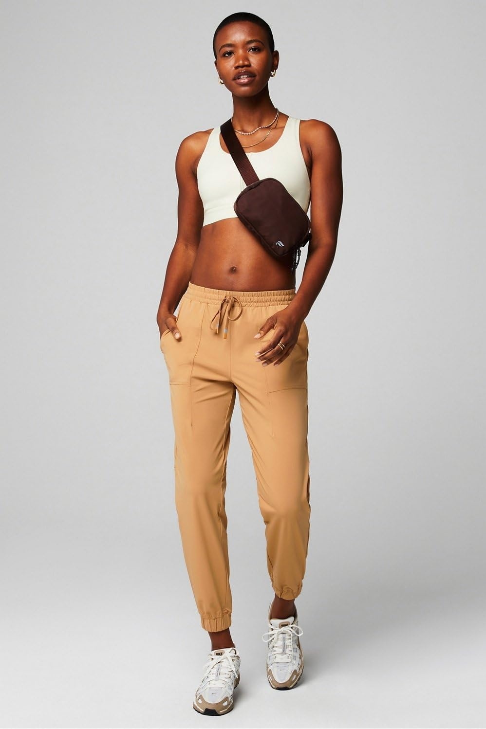 image:imageFabletics Womens The One Jogger QuickDry Hidden Pockets Zip Pockets UPF Protection AntiStink LightweightQuicksand