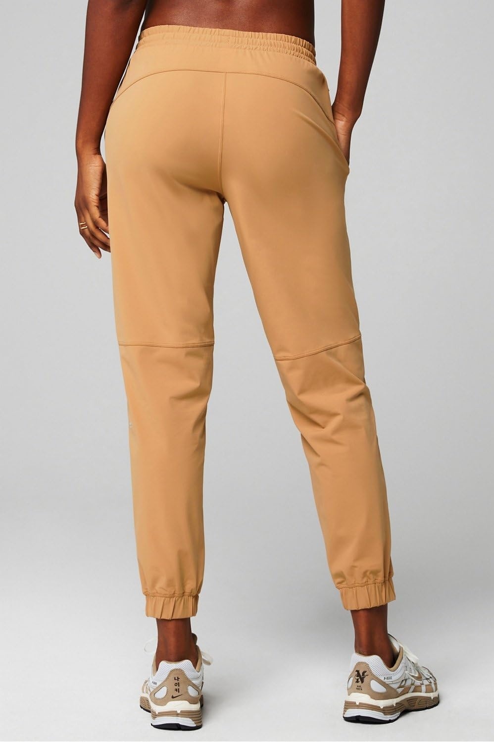 image:imageFabletics Womens The One Jogger QuickDry Hidden Pockets Zip Pockets UPF Protection AntiStink LightweightQuicksand