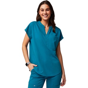 Fabletics Women’s Evolve 3-Pocket Scrub Top with an Oversized Fit – MotionTech, 4-Way Stretch, Wrinkle-Resist, Anti-Shrink(Caribbean Blue)